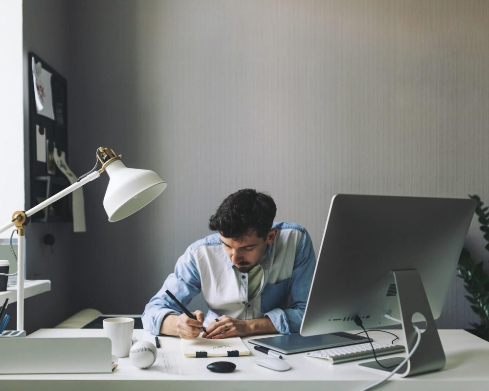 young-graphic-designer-working-in-office-1-pe7cjma72yo8pctm4zj8dueuoumn3w6ccni2tbw0g0